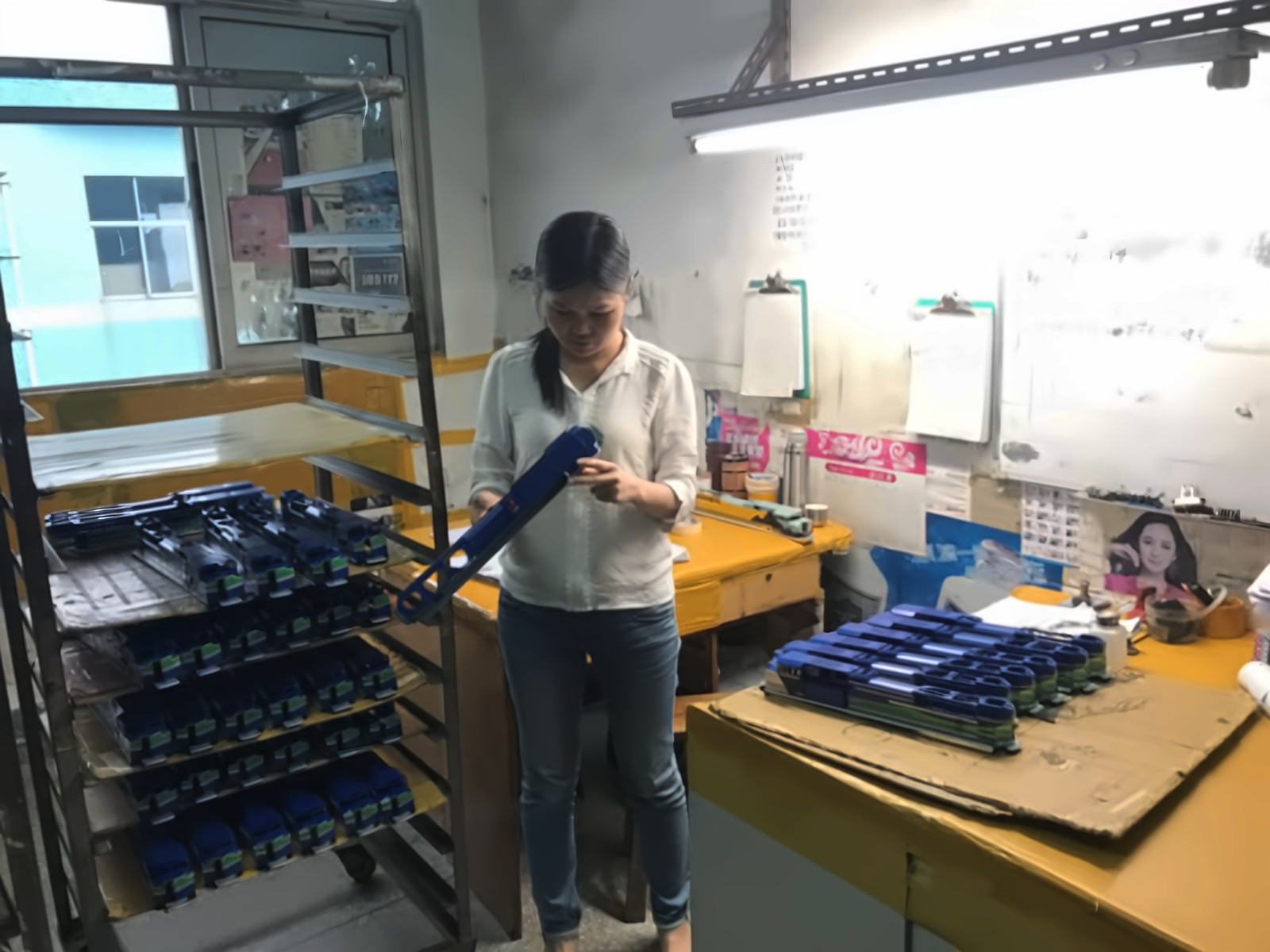 Quality control inspector checking model train parts